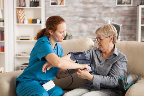 A VSH nurse caring for a patient at home